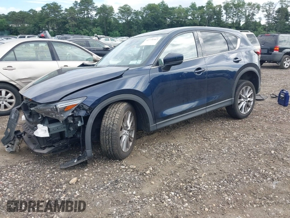 2019 Mazda CX-5 Grand Touring with VIN JM3KFBDM8K1521231, listed as a IAAI auction lot 42738963 with 32,179 mi miles and . Bid and sale history available at DreamBid. Image 2.