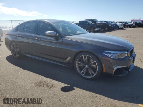 2019 BMW 5 Series M550i xDrive with VIN WBAJB9C57KB289036, listed as a Copart auction lot 86292134 with 28,103 mi miles and Salvage title. Bid and sale history available at DreamBid. Image 4.