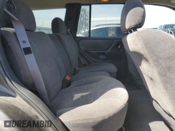 2000 Jeep Grand Cherokee Laredo z VIN 1J4GW48N9YC239166, wystawiony jako Copart lot #53321135 z przebiegiem 142 162 mil mil oraz Szkoda całkowita • Salvage title. Historia ofert i sprzedaży dostępna na DreamBid. Obrazek 11.