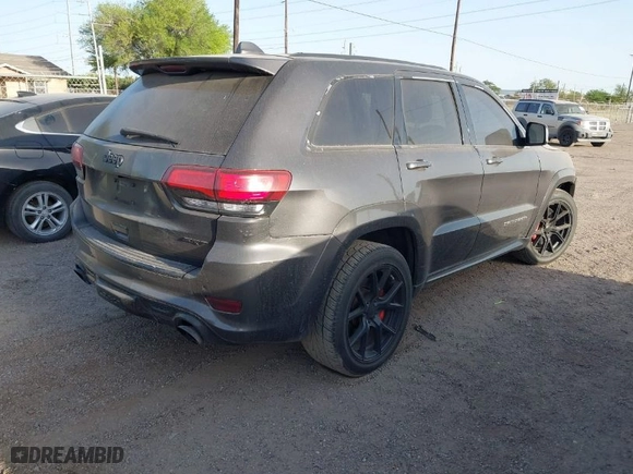 2015 Jeep Grand Cherokee SRT with VIN 1C4RJFDJ9FC842448, listed as a IAAI auction lot 41850385 with 178,439 mi miles. Bid and sale history available at carsss.com. Image 4.