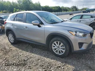 2014 Mazda CX-5 Touring z VIN JM3KE2CY0E0412733, wystawiony jako Copart lot #55803865 z przebiegiem 161 539 mil mil oraz Szkoda całkowita • Salvage title. Historia ofert i sprzedaży dostępna na DreamBid. Obrazek 4.