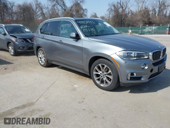 2015 BMW X5 xDrive35i with VIN 5UXKR0C53F0K60910, listed as a IAAI auction lot 41857733 with 153,583 mi miles. Bid and sale history available at carsss.com. Image 1.
