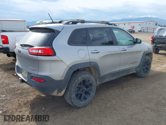 2015 Jeep Cherokee Trailhawk with VIN 1C4PJMBS0FW522182, listed as a IAAI auction lot 42544508 with 74,910 mi miles and . Bid and sale history available at DreamBid. Image 4.