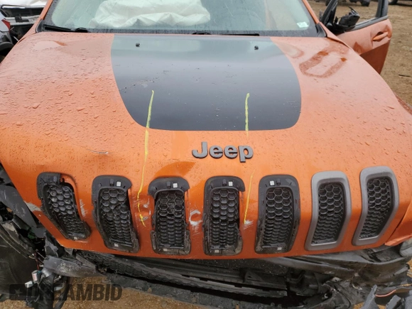 2015 Jeep Cherokee Trailhawk z VIN 1C4PJMBS7FW704980, wystawiony jako Copart lot #70334472 z przebiegiem 127 562 mil mil oraz Szkoda całkowita • Salvage title. Historia ofert i sprzedaży dostępna na DreamBid. Obrazek 12.