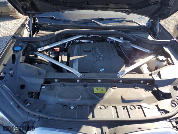 2021 BMW X6 xDrive40i with VIN 5UXCY6C07M9D94944, listed as a Copart auction lot 77106334 with 52,106 mi miles and Salvage Title. Bid and sale history available at carsss.com. Image 12.