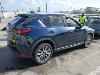 2021 Mazda CX-5 Grand Touring with VIN JM3KFBDM6M1312573, listed as a IAAI auction lot 41936739 with Not Provided miles and . Bid and sale history available at DreamBid. Image 4.