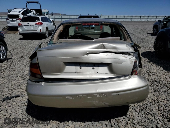 2002 Saturn SL z VIN 1G8ZH54852Z214519, wystawiony jako Copart lot #57287175 z przebiegiem 176 175 mil mil oraz Szkoda całkowita • Salvage title. Historia ofert i sprzedaży dostępna na DreamBid. Obrazek 6.