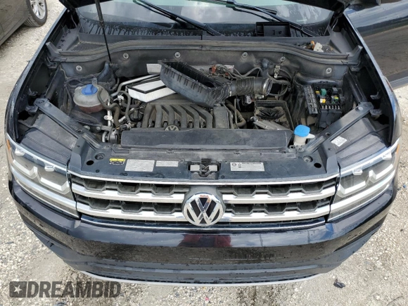 2018 Volkswagen Atlas SE z VIN 1V2CR2CA5JC582694, wystawiony jako Copart lot #56905595 z przebiegiem 111 842 mil mil oraz Czysty tytuł • Clean title. Historia ofert i sprzedaży dostępna na DreamBid. Obrazek 12.