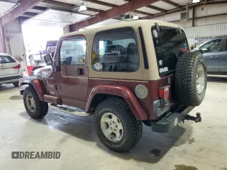 2002 Jeep Wrangler Sahara z VIN 1J4FA59S62P751858, wystawiony jako Copart lot #56638165 z przebiegiem 270 770 mil mil oraz Szkoda całkowita • Salvage title. Historia ofert i sprzedaży dostępna na DreamBid. Obrazek 2.