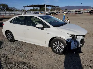 2021 Toyota Corolla Hybrid LE with VIN JTDEAMDE2MJ021576, listed as a Copart auction lot 49916105 with 24,292 mi miles and Salvage Title. Bid and sale history available at carsss.com. Image 4.