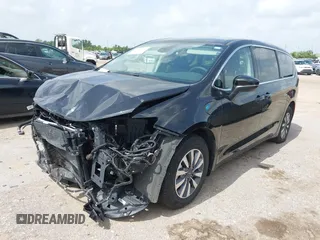 2023 Chrysler Pacifica Hybrid Touring L with VIN 2C4RC1L75PR611901, listed as a IAAI auction lot 42626500 with 44,156 mi miles and . Bid and sale history available at DreamBid. Image 2.
