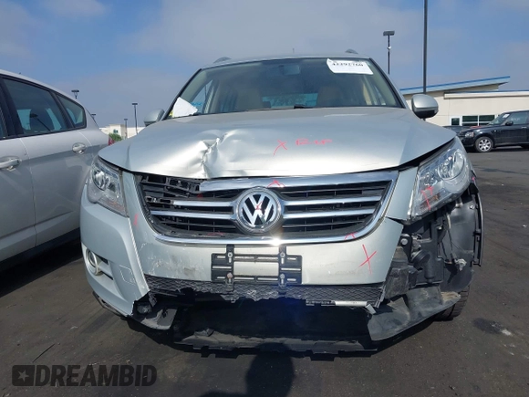2011 Volkswagen Tiguan SEL with VIN WVGBV7AX2BW500817, listed as a IAAI auction lot 42292760 with 50,336 mi miles and . Bid and sale history available at DreamBid. Image 6.