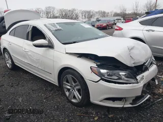 2014 Volkswagen CC Sport with VIN WVWBN7AN4EE505014, listed as a IAAI auction lot 41520345 with 140,422 mi miles. Bid and sale history available at carsss.com. Image 1.