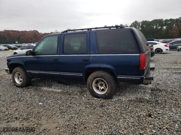 1999 Chevrolet Tahoe with VIN 1GNEC13R3XJ325377, listed as a Copart auction lot 83991974 with 257,816 mi miles and Salvage Title. Bid and sale history available at carsss.com. Image 2.