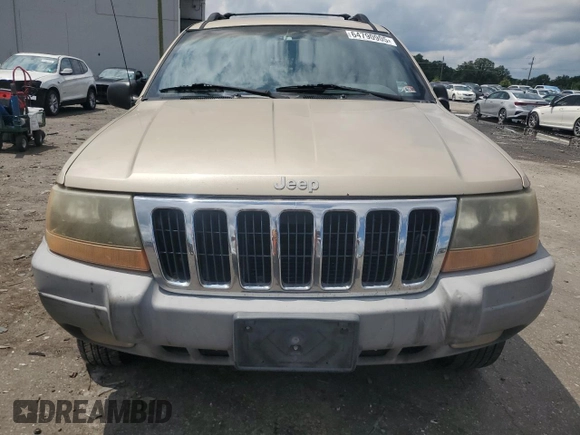 1999 Jeep Grand Cherokee Laredo with VIN 1J4GW58N7XC799434, listed as a Copart auction lot 64790905 with 272,384 mi miles and Salvage title. Bid and sale history available at DreamBid. Image 5.