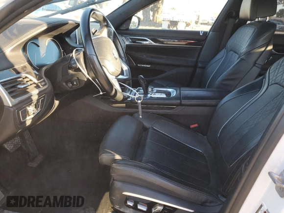 2016 BMW 7 Series 750i xDrive with VIN WBA7B0C59GG526741, listed as a Copart auction lot 86312384 with 90,360 mi miles and Salvage title. Bid and sale history available at DreamBid. Image 7.