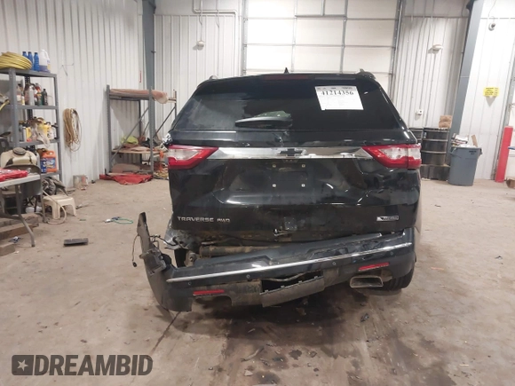 2018 Chevrolet Traverse Premier z VIN 1GNEVJKW6JJ179467, wystawiony jako IAAI lot #41214356 z przebiegiem 93 931 mil mil oraz . Historia ofert i sprzedaży dostępna na DreamBid. Obrazek 16.