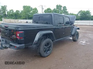 2023 Jeep Gladiator Overland with VIN 1C6JJTFM9PL593659, listed as a IAAI auction lot 42470253 with 34,374 mi miles and . Bid and sale history available at DreamBid. Image 4.