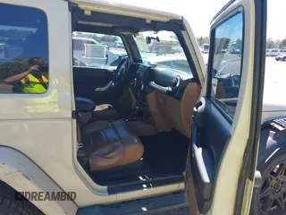 2011 Jeep Wrangler Sahara with VIN 1J4AA5D13BL562732, listed as a IAAI auction lot 41838520 with 148,359 mi miles and . Bid and sale history available at DreamBid. Image 5.