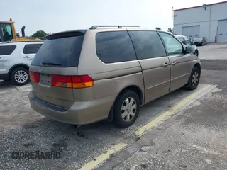 2004 Honda Odyssey EX-L z VIN 5FNRL18954B014748, wystawiony jako IAAI lot #42389048 z przebiegiem 136 176 mil mil oraz . Historia ofert i sprzedaży dostępna na DreamBid. Obrazek 4.