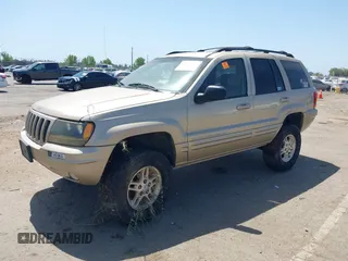 1999 Jeep Grand Cherokee Limited with VIN 1J4GW68N2XC654713, listed as a IAAI auction lot 42115829 with 195,988 mi miles. Bid and sale history available at carsss.com. Image 2.
