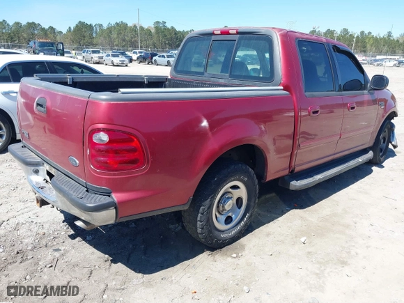 2001 Ford F-150 SuperCrew XLT with VIN 1FTRW07L11KE20412, listed as a IAAI auction lot 41877980 with 1 mi miles. Bid and sale history available at carsss.com. Image 4.