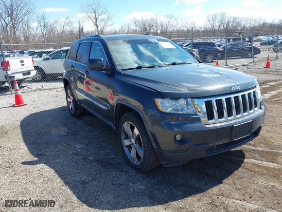 2011 Jeep Grand Cherokee Laredo with VIN 1J4RR4GT0BC543283, listed as a IAAI auction lot 41890109 with 123,325 mi miles. Bid and sale history available at carsss.com. Image 1.