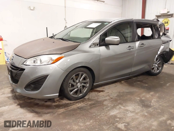 2012 Mazda 5 Sport z VIN JM1CW2BL1C0115371, wystawiony jako IAAI lot #42134834 z przebiegiem 138 840 mil mil oraz . Historia ofert i sprzedaży dostępna na DreamBid. Obrazek 2.