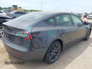2023 Tesla Model 3 with VIN 5YJ3E1EA5PF565071, listed as a IAAI auction lot 42232719 with 15,389 mi miles and . Bid and sale history available at DreamBid. Image 4.