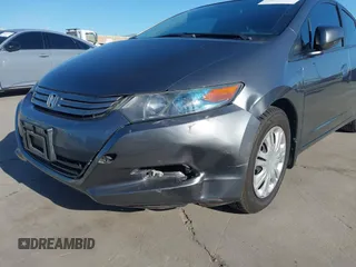 2010 Honda Insight LX with VIN JHMZE2H50AS019740, listed as a IAAI auction lot 41665527 with 74,022 mi miles and . Bid and sale history available at DreamBid. Image 6.