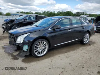 2014 Cadillac XTS Platinum z VIN 2G61S5S32E9325283, wystawiony jako Copart lot #57302375 z przebiegiem 80 672 mil mil oraz Szkoda całkowita • Salvage title. Historia ofert i sprzedaży dostępna na DreamBid. Obrazek 1.