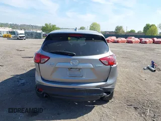 2014 Mazda CX-5 Grand Touring with VIN JM3KE4DY7E0311893, listed as a IAAI auction lot 42090872 with 102,154 mi miles and . Bid and sale history available at DreamBid. Image 16.