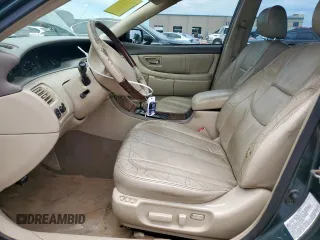 2003 Toyota Avalon XL z VIN 4T1BF28BX3U310285, wystawiony jako Copart lot #57664375 z przebiegiem 179 727 mil mil oraz Szkoda całkowita • Salvage title. Historia ofert i sprzedaży dostępna na DreamBid. Obrazek 7.