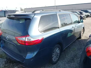 2016 Toyota Sienna XLE with VIN 5TDYK3DC8GS720852, listed as a IAAI auction lot 41341268 with 119,927 mi miles. Bid and sale history available at carsss.com. Image 4.