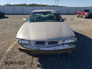 1999 Pontiac Bonneville SE z VIN 1G2HX52K4XH247855, wystawiony jako Copart lot #72559044 z przebiegiem 160 677 mil mil oraz Szkoda całkowita • Salvage title. Historia ofert i sprzedaży dostępna na DreamBid. Obrazek 5.