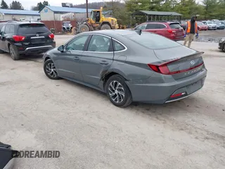 2022 Hyundai Sonata Hybrid Blue with VIN KMHL24JJ2NA048439, listed as a IAAI auction lot 40942477 with 64,855 mi miles. Bid and sale history available at carsss.com. Image 3.