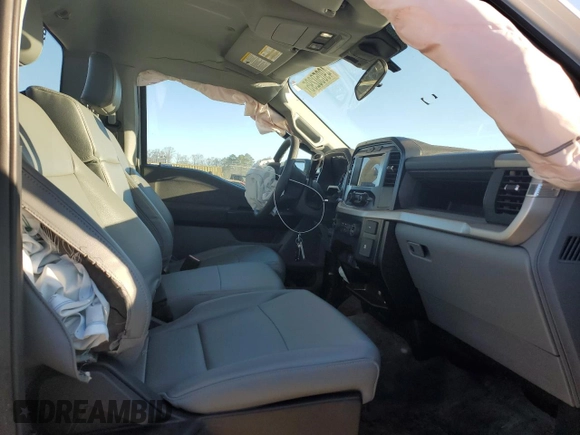 2023 Ford F-150 XL with VIN 1FTMF1CB2PKG05574, listed as a Copart auction lot 49050295 with 33,563 mi miles and Salvage Title. Bid and sale history available at carsss.com. Image 10.