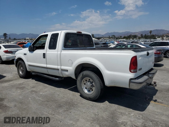 1999 Ford F-250 XL with VIN 1FTNX20L8XEB01923, listed as a Copart auction lot 65404495 with 383,297 mi miles and Salvage title. Bid and sale history available at DreamBid. Image 2.