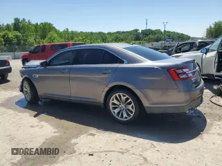 2013 Ford Taurus Limited with VIN 1FAHP2F85DG225363, listed as a Copart auction lot 56127255 with 128,660 mi miles and Salvage title. Bid and sale history available at DreamBid. Image 2.
