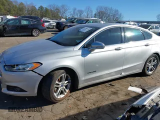 2016 Ford Fusion Titanium Hybrid with VIN 3FA6P0RU7GR364573, listed as a IAAI auction lot 41298298 with 189,900 mi miles. Bid and sale history available at carsss.com. Image 14.