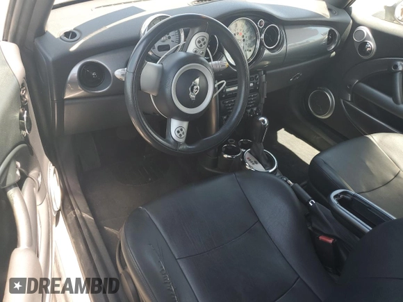 2006 MINI Convertible with VIN WMWRF33576TG16056, listed as a Copart auction lot 63127705 with 108,654 mi miles and Salvage title. Bid and sale history available at DreamBid. Image 8.
