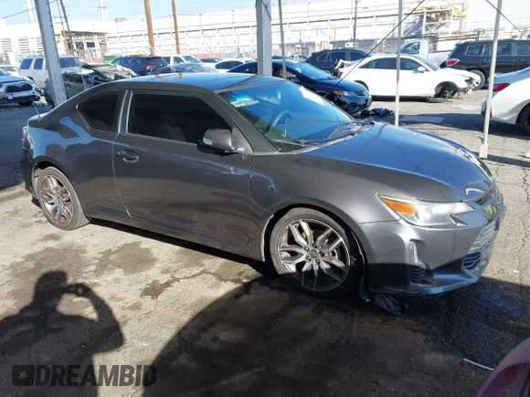 2016 Scion tC with VIN JTKJF5C78GJ014184, listed as a IAAI auction lot 41622575 with 128,520 mi miles. Bid and sale history available at carsss.com. Image 1.