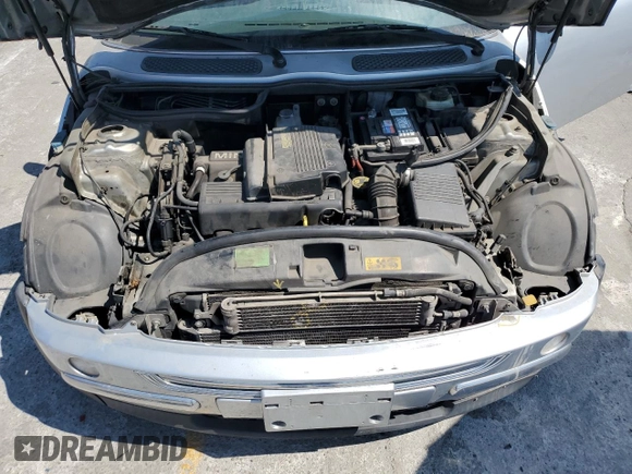 2003 MINI Hardtop with VIN WMWRC33453TE14909, listed as a Copart auction lot 65419725 with 111,960 mi miles and Salvage title. Bid and sale history available at DreamBid. Image 11.