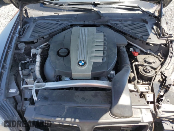 2011 BMW X5 35d with VIN 5UXZW0C58BL662048, listed as a Copart auction lot 52158795 with 166,291 mi miles and Salvage title. Bid and sale history available at DreamBid. Image 12.