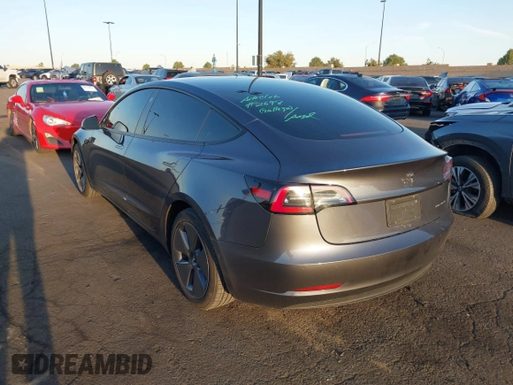 2021 Tesla Model 3 Long Range with VIN 5YJ3E1EBXMF995814, listed as a IAAI auction lot 41838453 with 51,415 mi miles. Bid and sale history available at carsss.com. Image 3.