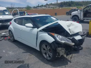 2013 Hyundai Veloster w/Black Int z VIN KMHTC6ADXDU100979, wystawiony jako IAAI lot #42369224 z przebiegiem Nie podano mil oraz . Historia ofert i sprzedaży dostępna na DreamBid. Obrazek 1.