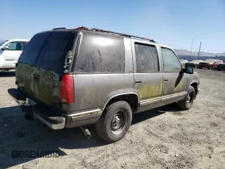 1999 GMC Yukon with VIN 1GKEC13R5XJ761595, listed as a Copart auction lot 69677904 with 174,735 mi miles and Clean Title. Bid and sale history available at carsss.com. Image 3.