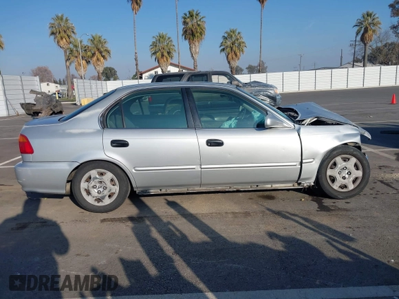 1999 Honda Civic EX with VIN JHMEJ8648XS000823, listed as a IAAI auction lot 41479594 with 299,294 mi miles. Bid and sale history available at carsss.com. Image 14.