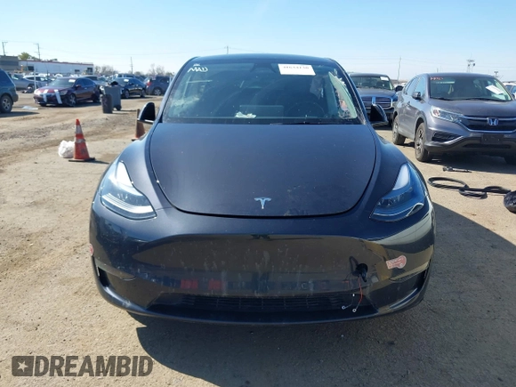 2024 Tesla Model Y with VIN 7SAYGDED8RF213796, listed as a IAAI auction lot 41634130 with 7,710 mi miles and . Bid and sale history available at DreamBid. Image 11.