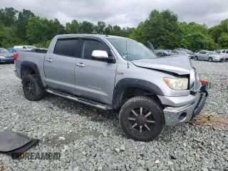 2012 Toyota Tundra Limited with VIN 5TFHW5F18CX233781, listed as a Copart auction lot 57956925 with 208,629 mi miles and Salvage title. Bid and sale history available at DreamBid. Image 4.